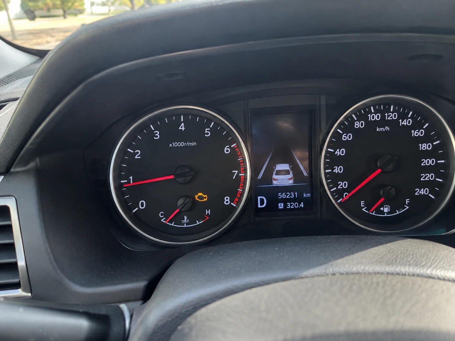 Photo sent: the orange check engine light on the dashboard